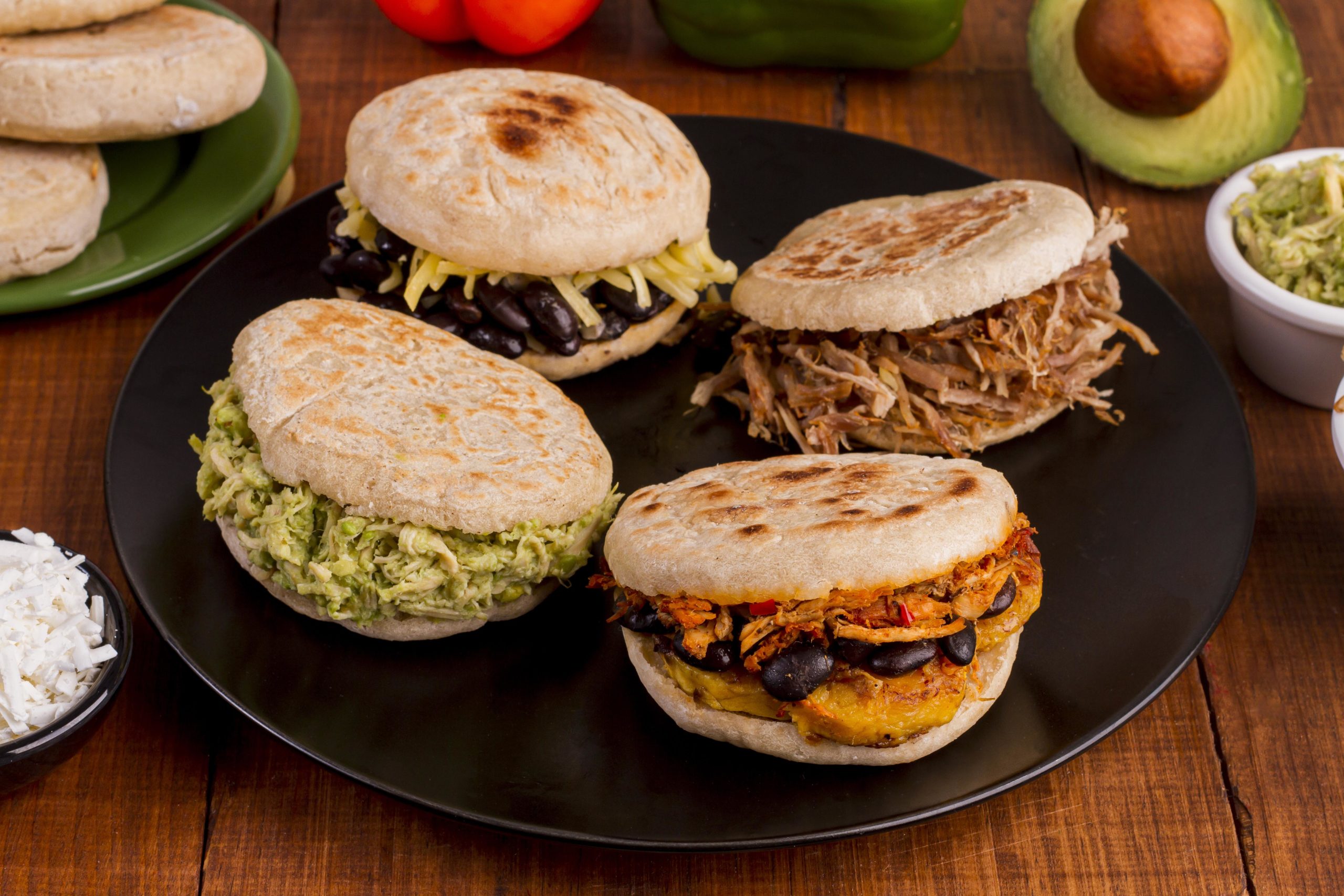 assortment-of-arepas-with-filling-on-plate